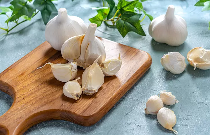 Cloves of garlic on a wooden tray
