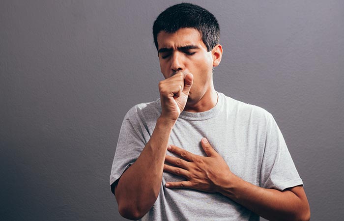 Man coughing as a side effect of pumpkin seeds