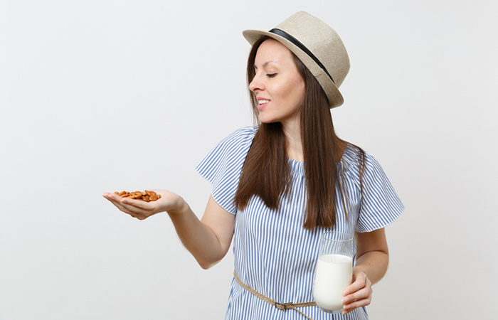 Woman thinking how many almonds she can have in a day