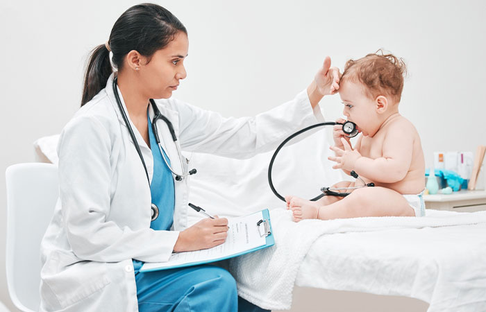Doctor examining infant experiencing health issues due to soy proteins