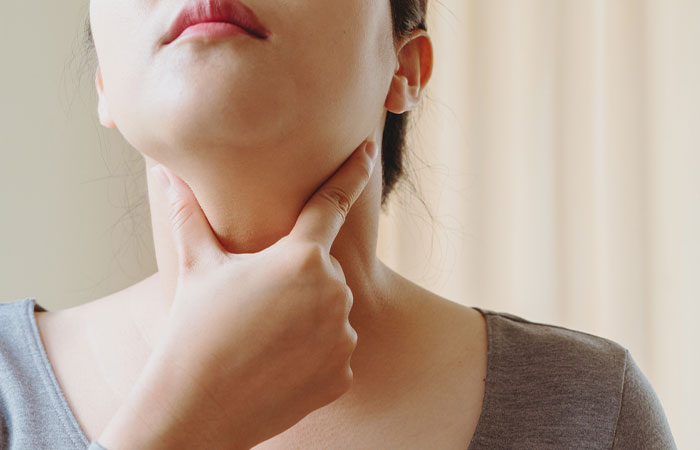 Woman experiencing thyroid problems as a side effect of soy proteins