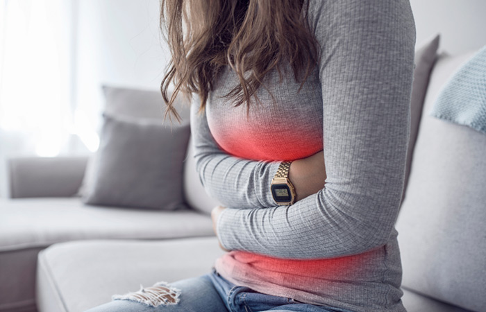 Woman suffering with upset stomach