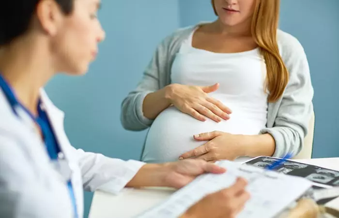 Pregnant woman consulting a doctor to know about the side effect of pumpkin seeds