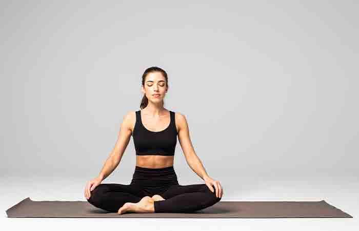 Woman practicing padmasana to improve brain power