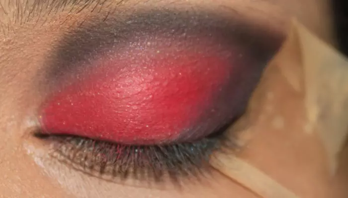 Step 6 of red and black eye makeup