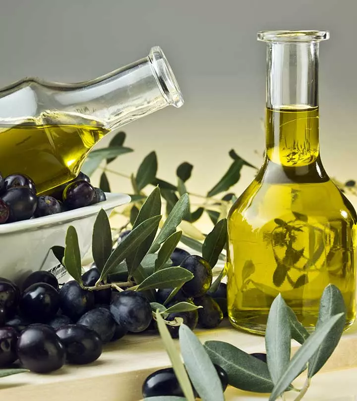 Flaska med olivolja och oliver