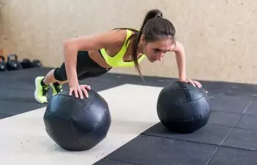 Medicine ball push-up chest exercise for women