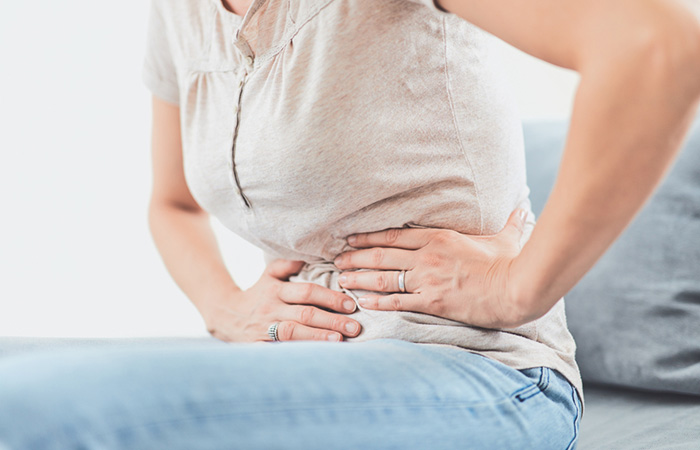Woman suffering with digestive issues
