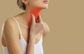 Woman suffering with hyperthyroidism