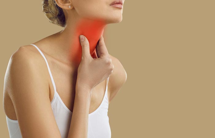 Woman suffering with hyperthyroidism