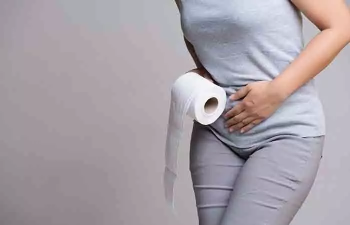 Woman experiencing diarrhea as a side effect of having honey