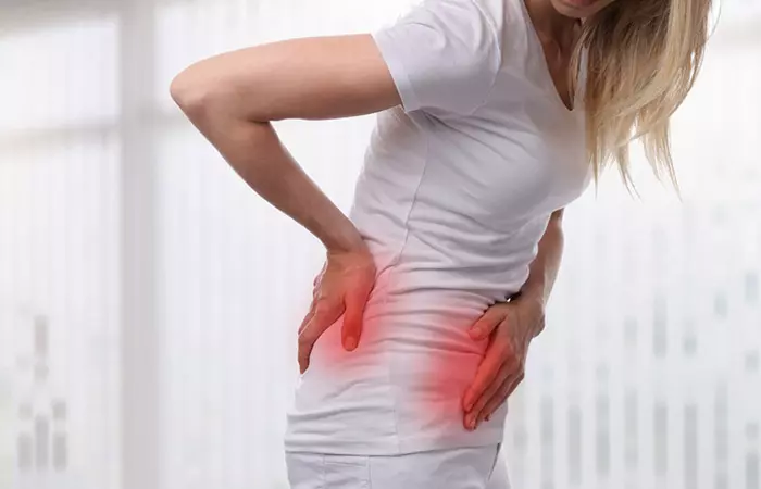 A woman with pain in her back and the groin area