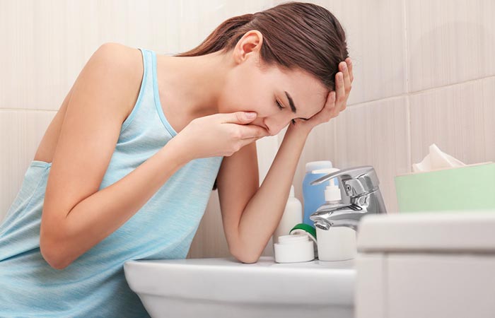 Woman experiences nausea and vomiting