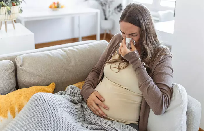 Pregnant woman experiencing allergies due to fenugreek consumption