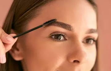 Brush your eyebrows with old mascara wand