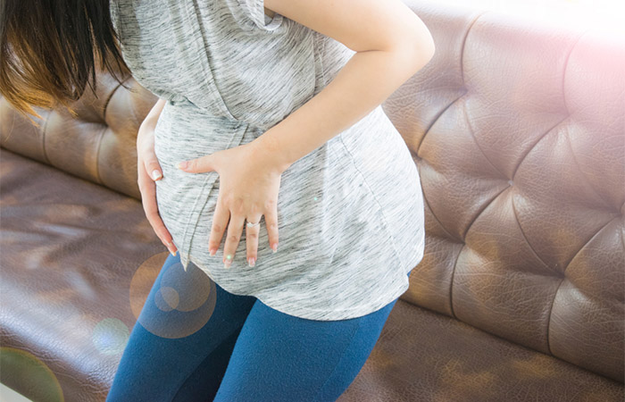 Pregnant woman experiencing digestive problems after eating fenugreek