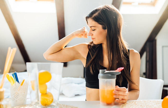 Woman drinking juice to boost immunity