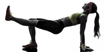 Reverse plank workout with leg lift