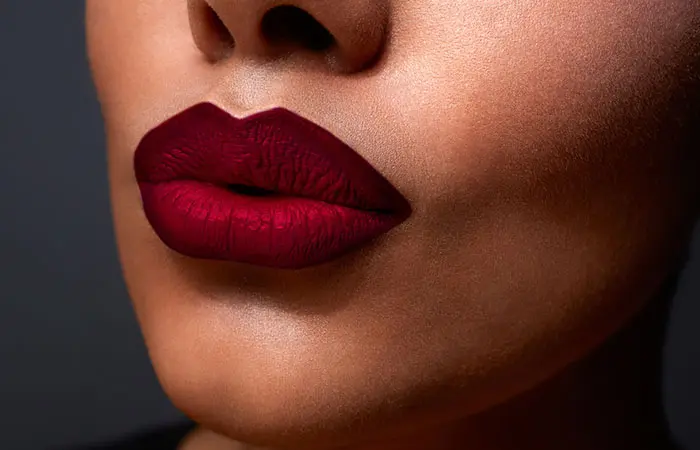 Woman wearing dark red lipstick