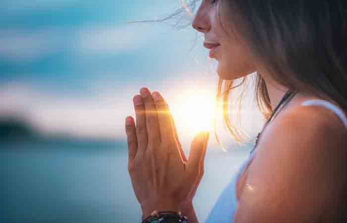 Woman praying for divine blessings