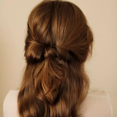A girl with half-pony hairstyle