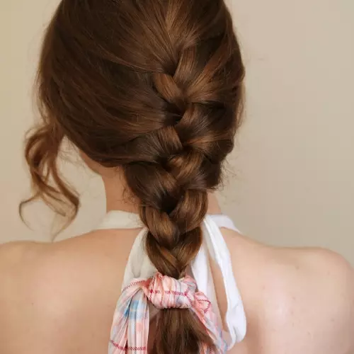 A woman with simple braided hairstyle