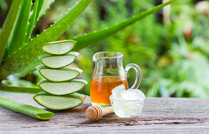 Aloe vera leaves and a jar of honey for stretch marks.