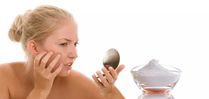 Woman worried about acne breakout that might be treated with baking soda
