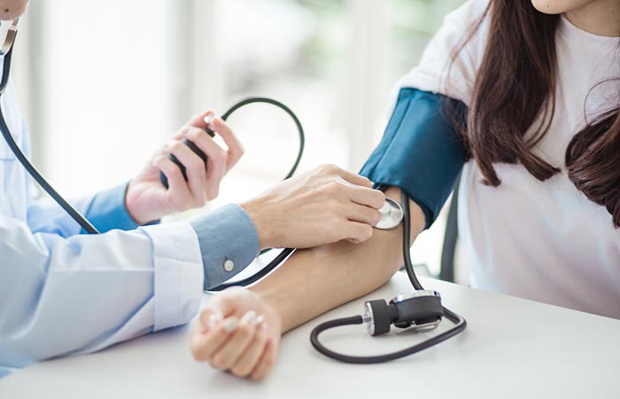 Woman with high blood pressure as a side effect of licorice root extract