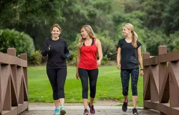 Women runners walking between their run