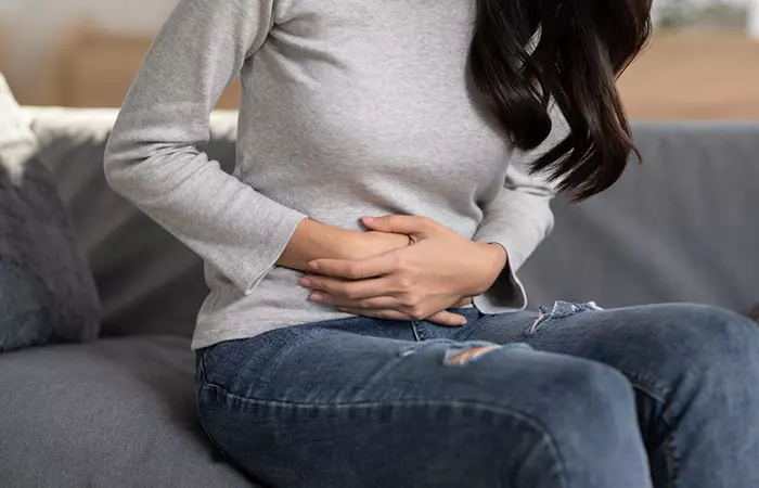 A woman struggling with stomach ulcers