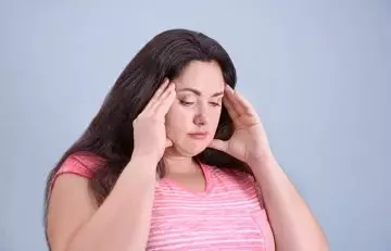 Headache may be a symptom of hormonal weight gain