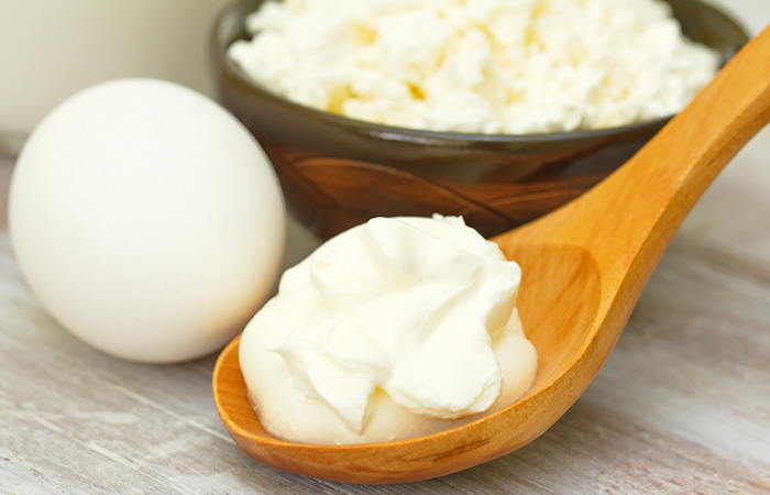 Yogurt, cream, and an egg for preparing protein-rich hair masks