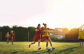 Teen girls play soccer to stay active and for weight loss