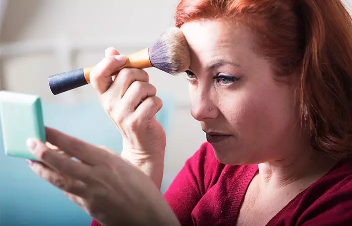 Apply dark bronzer on temples and near hairline to make forehead look smaller