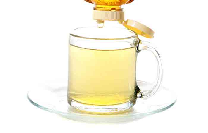 A glass of plain warm honey water for weight loss