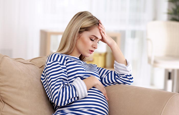 Pregnant woman experiencing side effect of excess tulsi consumption