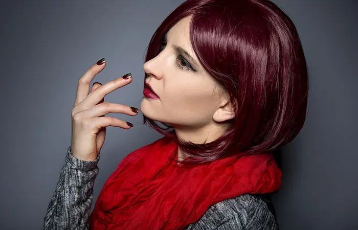 Woman in red burgundy hair color