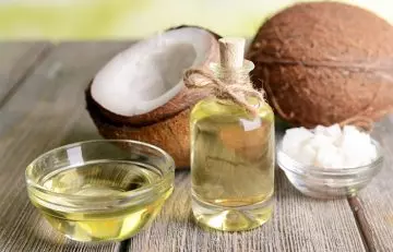 Coconut oil in a glass bowl and bottle