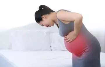 Woman suffering with labour pain