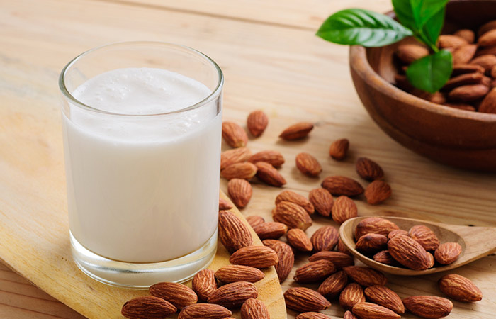 Almonds and milk on the table for muscle weakness