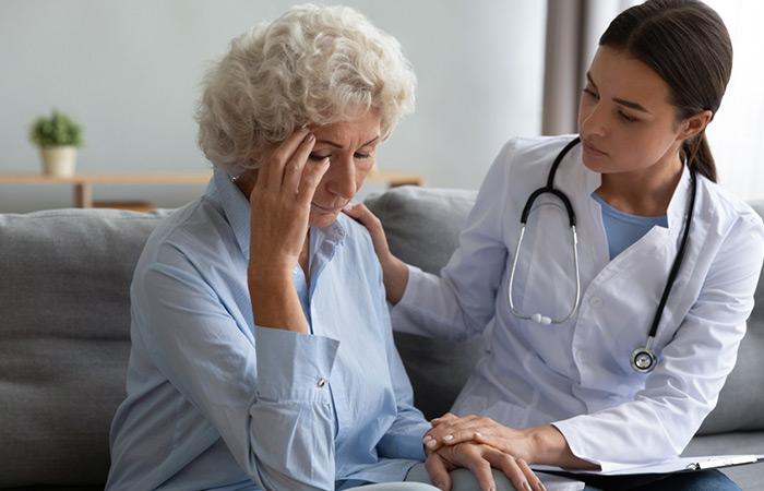 Senior Alzheimer’s patient with a doctor