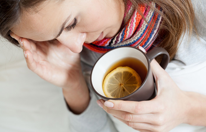 Dehydrated woman with a cup of lemon tea