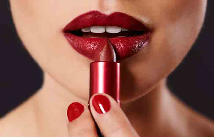 Focus attention on lips with dark red lipstick to hide double chin