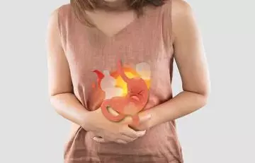 Woman having symptoms of burning stomach.