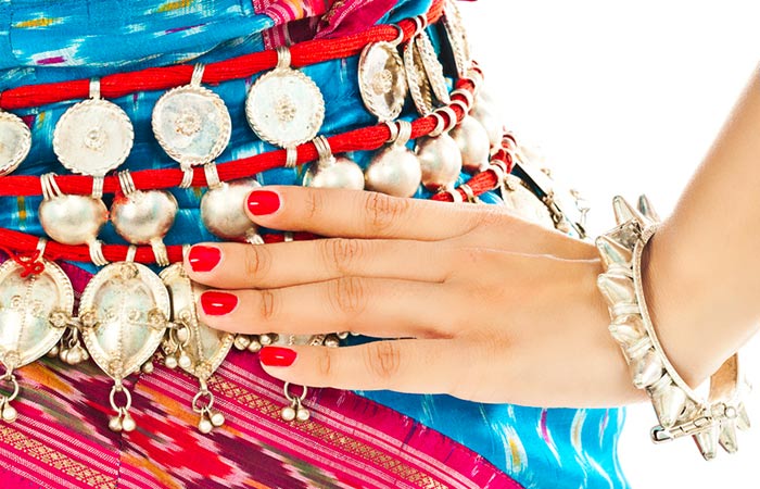 Woman wearing trendy waist chain on saree