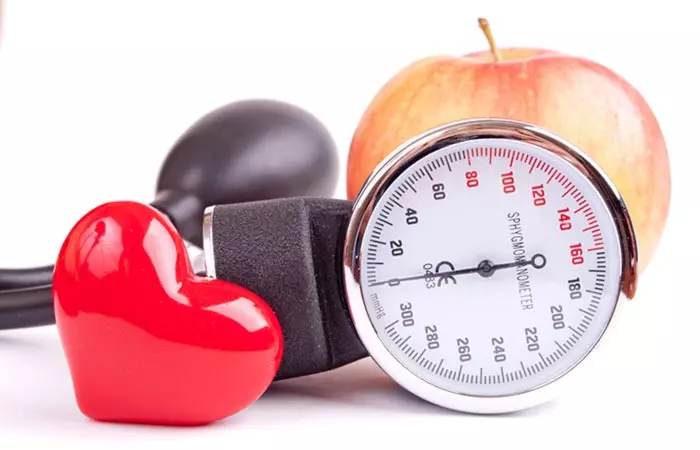 Woman experiencing low blood pressure as a side effect of consuming cilantro