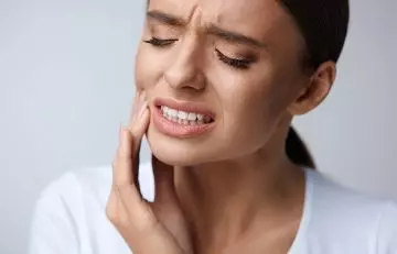 Woman suffering from toothache 