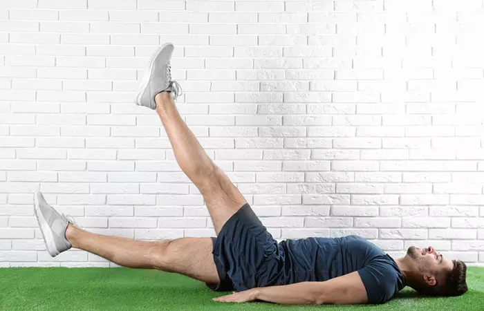 Woman performing scissor kicks