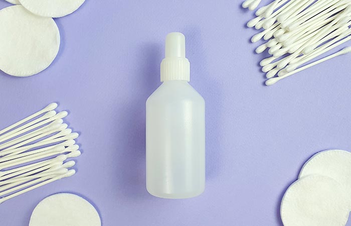 Bottle of hydrgen peroxide and cotton swabs